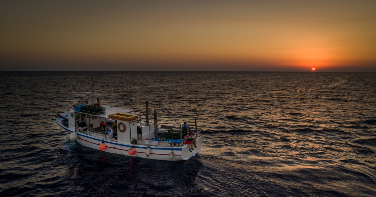 Santorini Sunset Fishing Trip with Dinner and Drinks | GetYourGuide