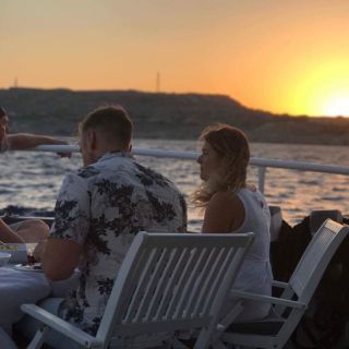 Rhodes: Sunset Dinner Cruise with Unlimited Wine and Beer