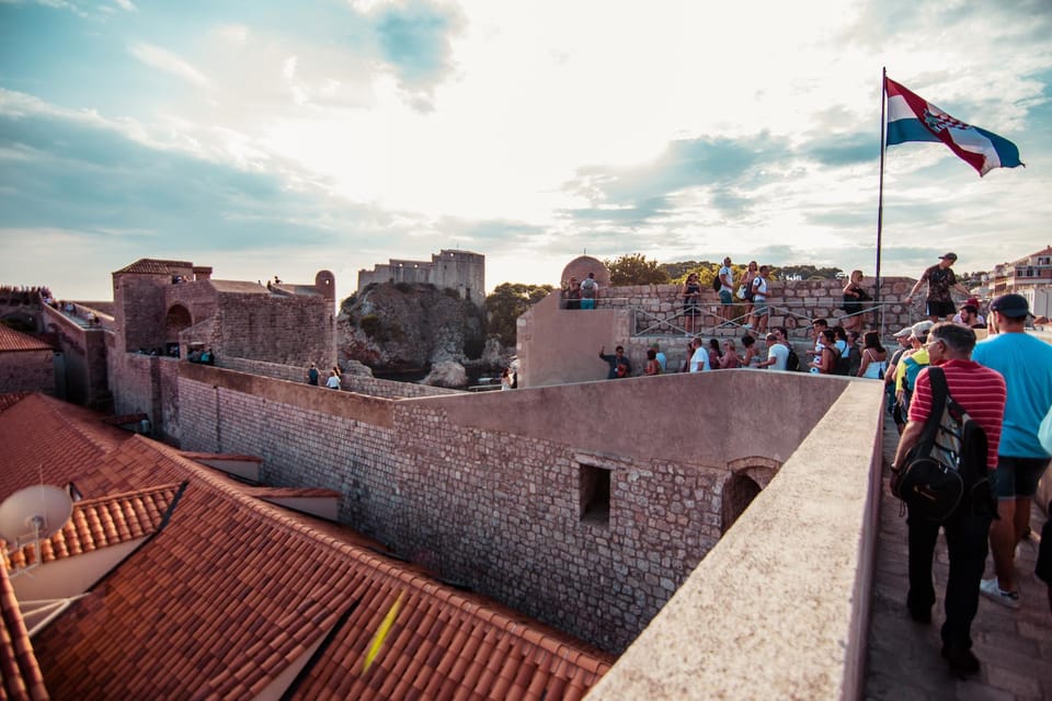 Visitors walking the Dubrovnik City Walls on a Walls and Wars tour