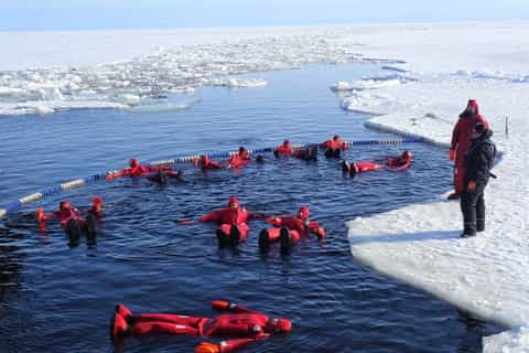 Lapland: Hiking, Ice Fishing, Floating & BBQ Snow Adventure