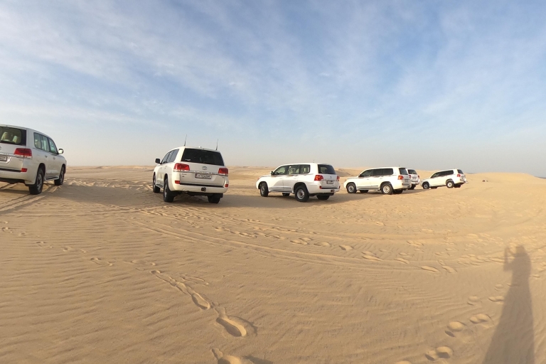 Depuis l'aéroport de Doha Demi-journée de safari dans le désert avec balade à dos de chameauDepuis l'aéroport de Doha Safari dans le désert d'une demi-journée avec promenade à dos de chameau