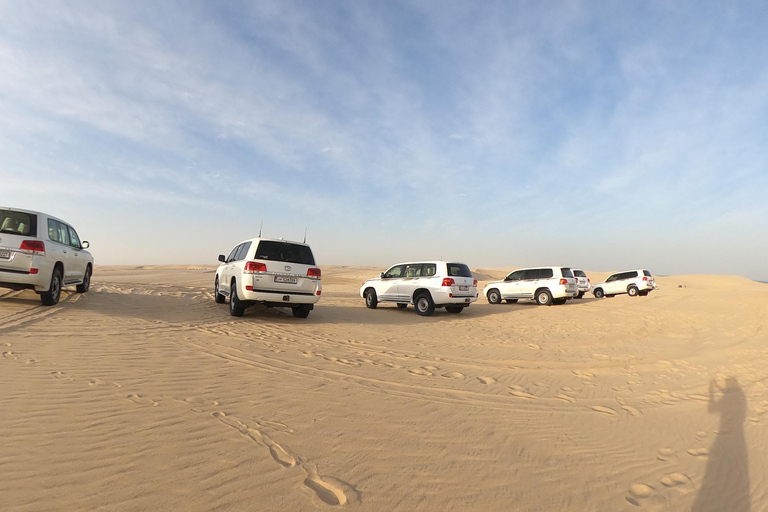 Depuis l'aéroport de Doha Demi-journée de safari dans le désert avec balade à dos de chameauDepuis l'aéroport de Doha Safari dans le désert d'une demi-journée avec promenade à dos de chameau