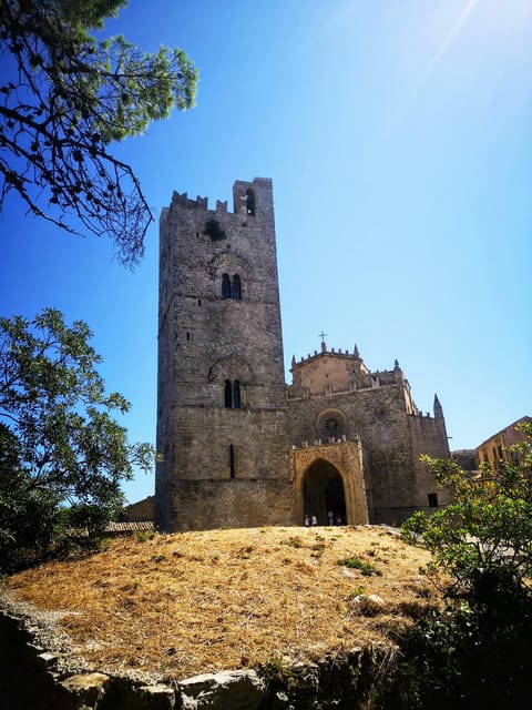 Stone lanes and tiled roofs climbing through the medieval hill town of Erice