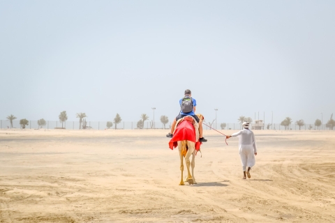 Doha: 5-Hour Safari, Camel Ride, Sandboarding & Inland Sea Doha Desert Safari : Camel Ride, Sandboarding & Inland Sea