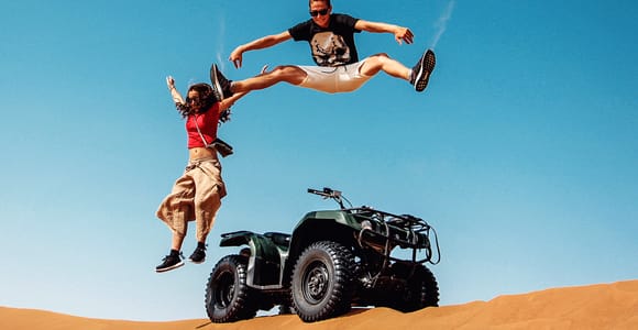 Dubai: Red Dunes Quad Bike with Sandboarding, Camels and BBQ
