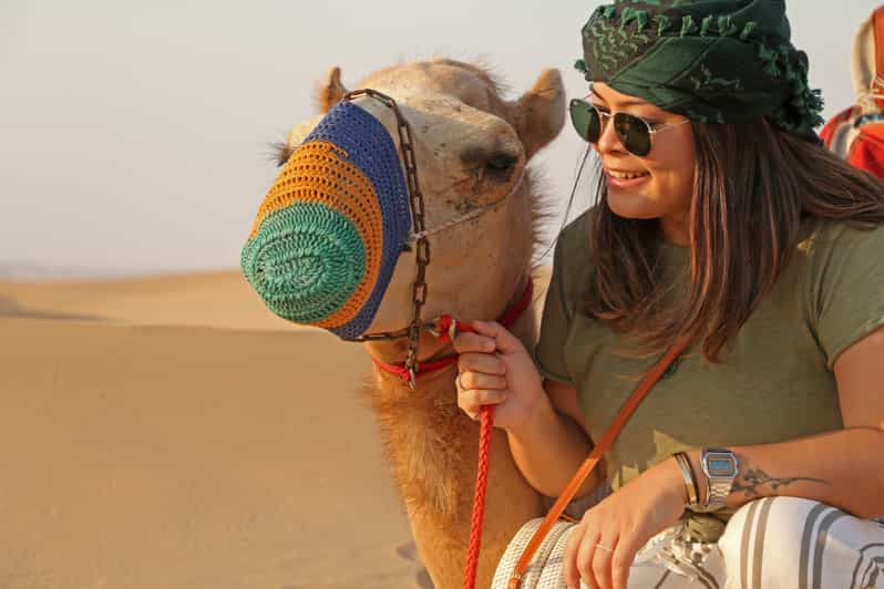 Dubai: Red Dune Quad Bike Tour With Camel Ride And Barbecue | GetYourGuide