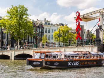 Amsterdam: Fahrt mit halboffenem Grachtenboot Amsterdam: Fahrt mit halboffenem Grachtenboot