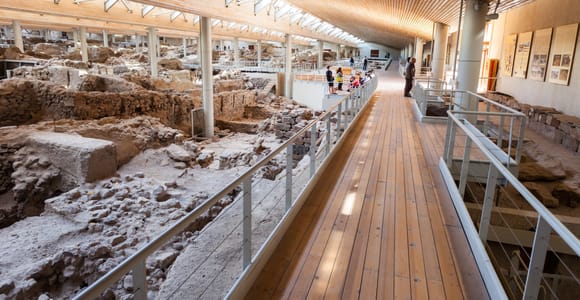 Stone walls and pathways inside the sheltered Akrotiri archaeological site