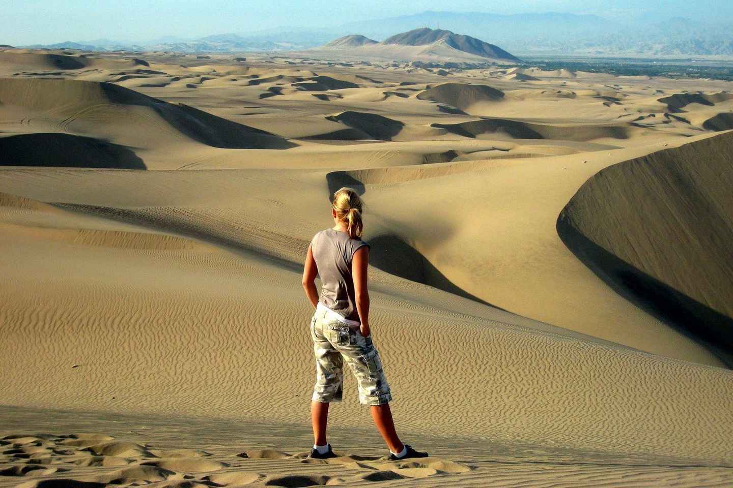 things to do in peru | sandboarding and dune buggy ride on the sand dunes of huacachina