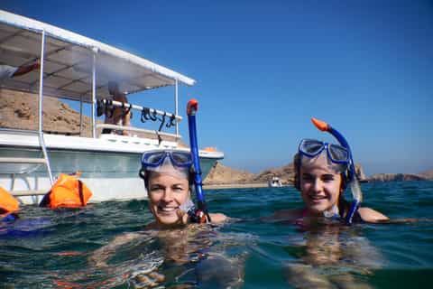 Muscat: Dolphin Watching and Snorkeling Tour