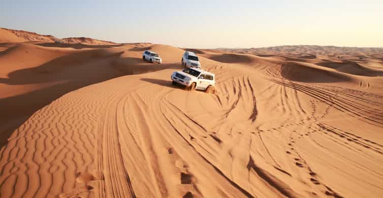 Dubai: Red Dune Safari with Quad Bike, Sandboard & Camels | GetYourGuide