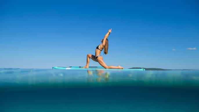 pula standup paddleboard yoga classes at morning sunset