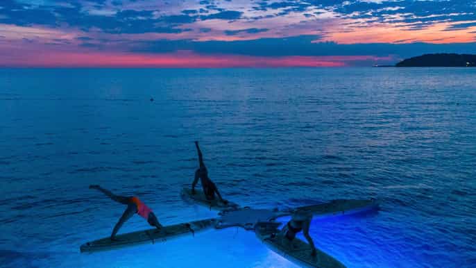pula night glow sup yoga class