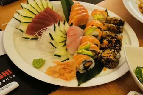 from olhão private boat tour with sushi meal on the beach