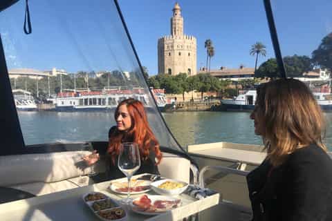 Seville: Exclusive River Boat Tour with Tapas