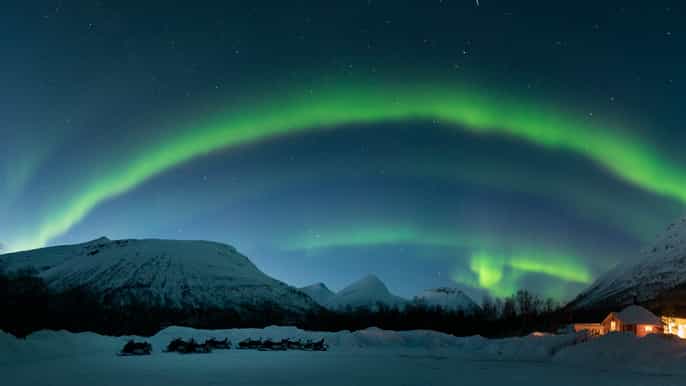 tromso snowmobiling under the northern lights