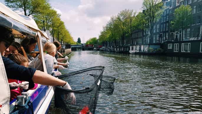 amsterdam canal plastic fishing cruise with breakfast