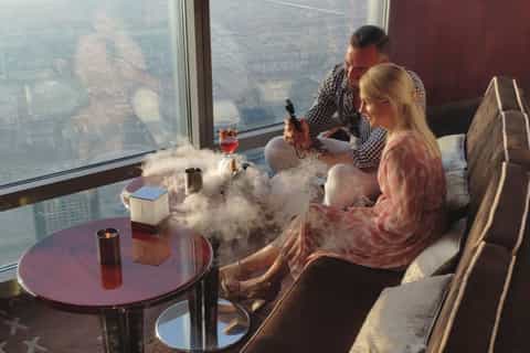 Dubai: Burj Khalifa viplounge met panoramische zonsondergang