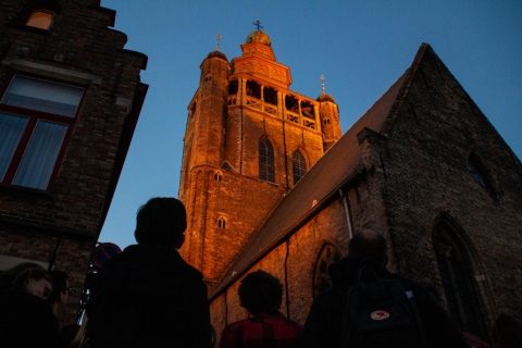 Bruges: visite privée en soirée du côté obscur de Bruges d'une heure et demieVisite en français