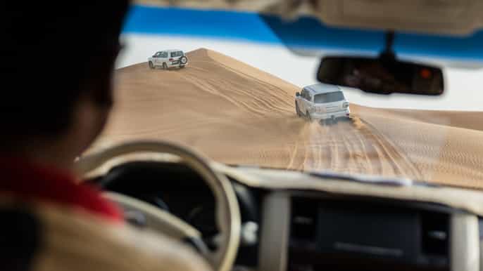 abu dhabi desert safari with bbq camel ride sandboarding