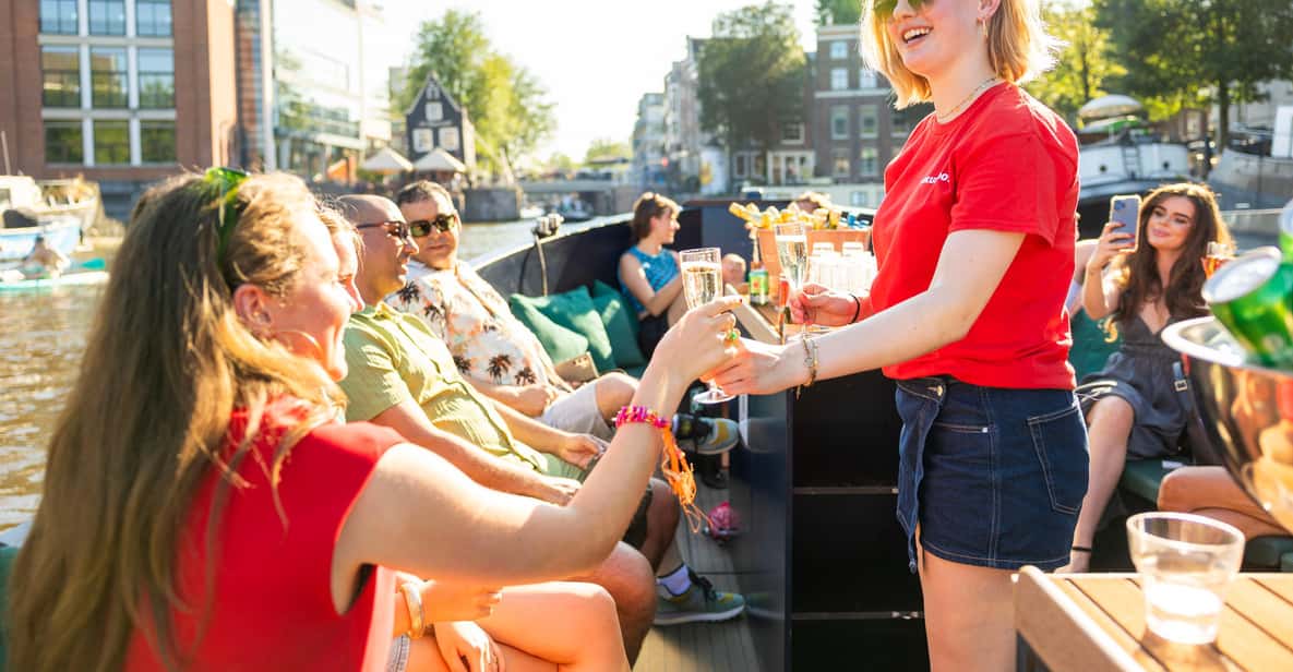 Afbeelding 1 van Amsterdam: begeleide open boottocht met onbeperkt drankjes