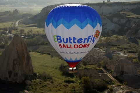 cappadocia sunrise hotair balloon with butterfly balloons