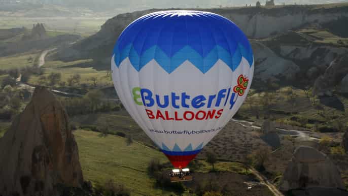 cappadocia sunrise hotair balloon with butterfly balloons