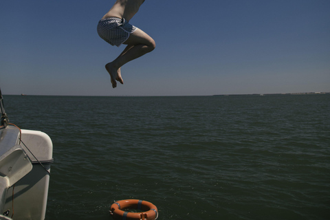 Lisbon Boat Party w/ Open Bar, Music and Swimming Stops Lisbon: Catamaran Boat Party with Music, Open Bar & Swimming