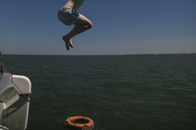 Lisbon Boat Party w/ Open Bar, Music and Swimming Stops Lisbon: Catamaran Boat Party with Music, Open Bar & Swimming