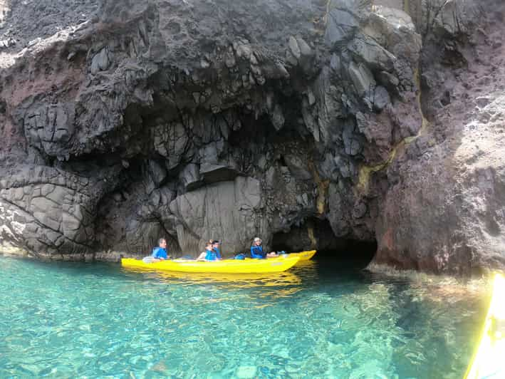 Santorini: Sea Caves Kayak Trip With Snorkeling And Picnic | GetYourGuide