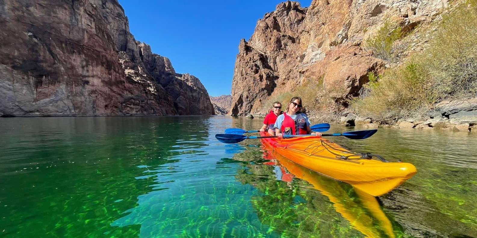 Clear-bottom transparent kayak on emerald water, Black Canyon