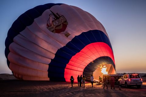 Dubai: Hot Air Balloon Ride with Camel Ride & Falcon Photo