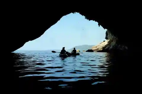 From Agios Ioannis Beach: Kayak Day Trip to Papanikolis Cave