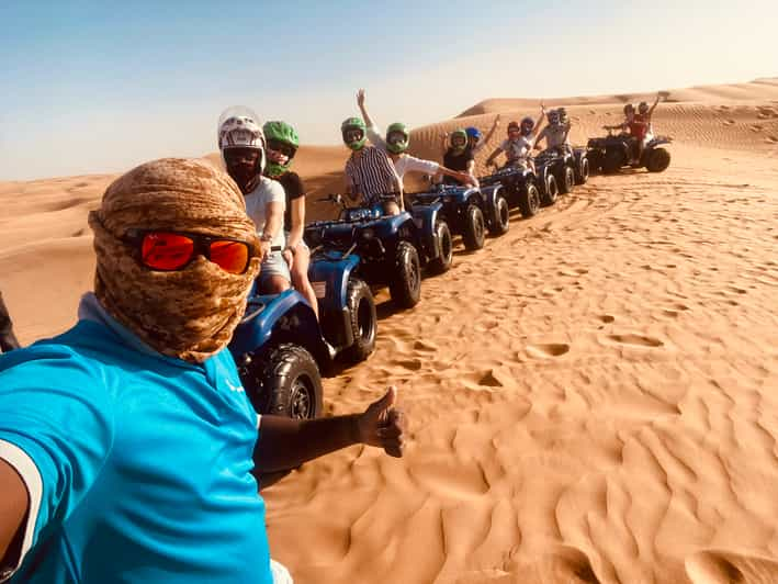 Dubai: Red Dunes ATV, Sandsurf, Camels And BBQ Dinner | GetYourGuide