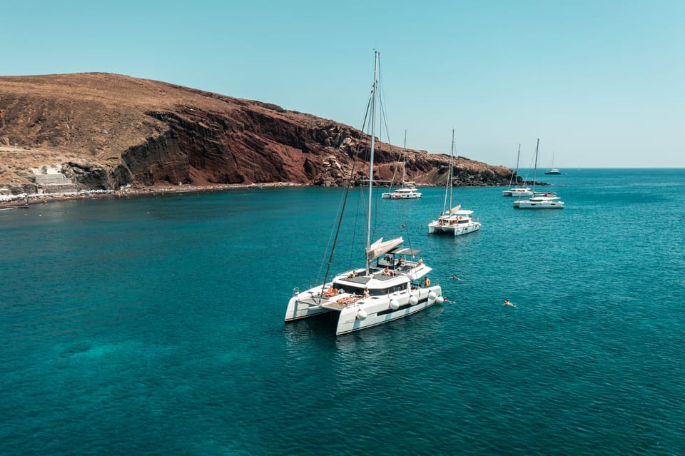 Santorini: Majestic Catamaran Cruise with Meal and Drinks | GetYourGuide