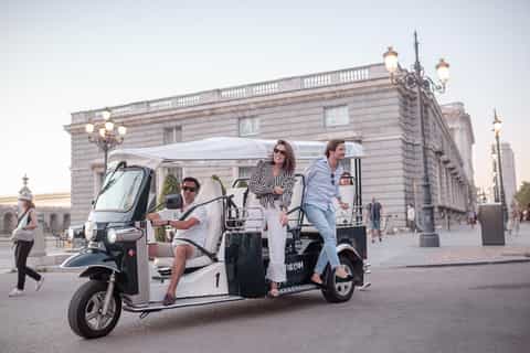 Eco tuk tuk city tour passing near Prado Museum and central Madrid sights