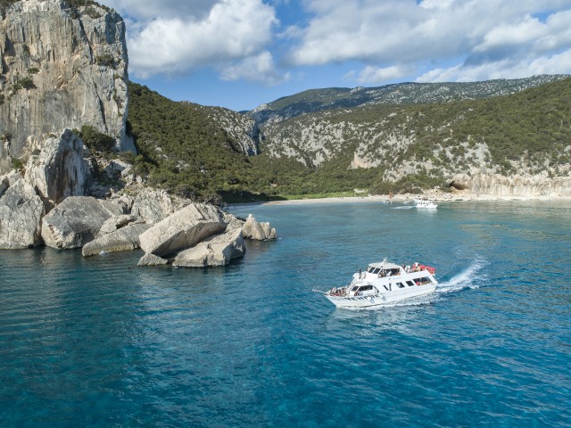 Visit Cala Gonone Gulf of Orosei Day Trip by Boat with Swim Stops in Lake Garda