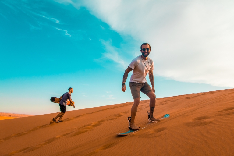 Dubai: Desert Quad Bike Safari, Camel Ride, Sand Surf, & BBQ Shared Tour with Shared Bike Ride