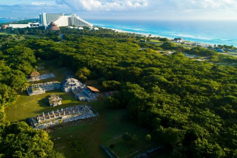 From Cancún: Archeological Sites and Playa Delfines Express