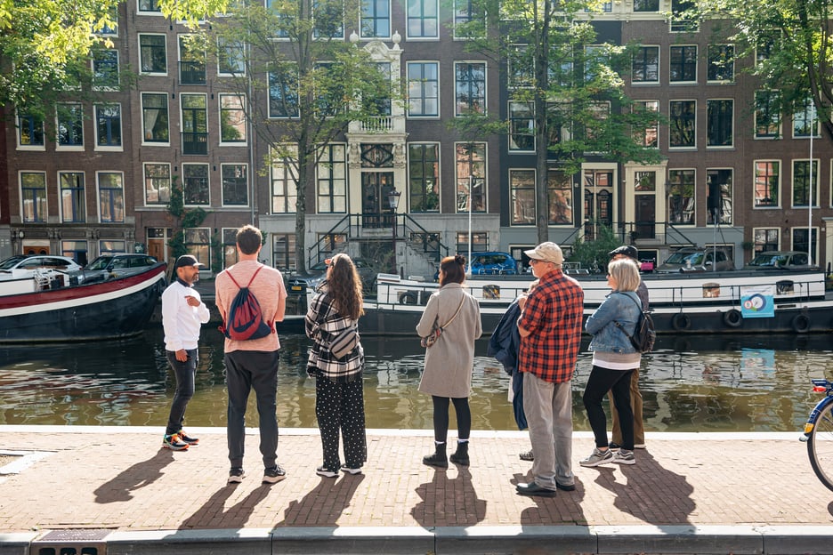 Amsterdam: Tour a piedi con i punti salienti e la storia di Amsterdam