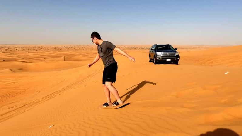 Dubai Sandboarding Camel Ride And Red Dune Bashing Safari Getyourguide