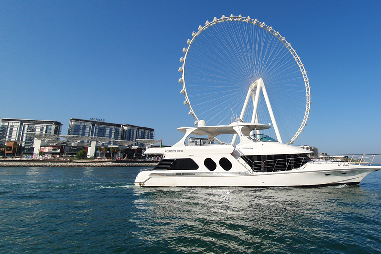 Dubai, Dubai Marina Sightseeing-kryssning med utsikt över Ain WheelSightseeingkryssning i småbåtshamn ombord på en yacht