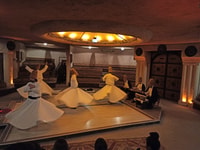 Goreme, Whirling Dervishes Show in Historical Trade Mansion - Housity