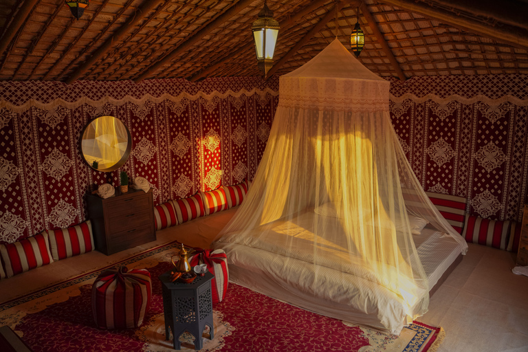 From Dubai: Red Dunes and Camel Safari with Overnight Camp Shared Tour with Private Tent