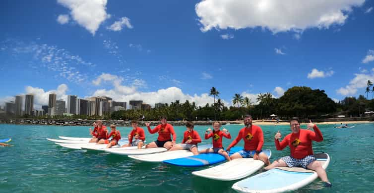 Family Surfing Lesson: 1 parent, 1 child under 13, & others | GetYourGuide