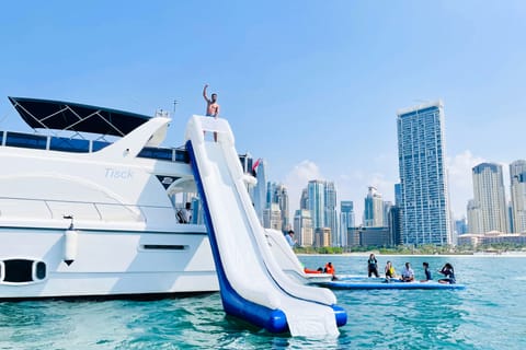 Dubai: Yacht Ride & Slide, Swim & Snorkel with BBQ Lunch