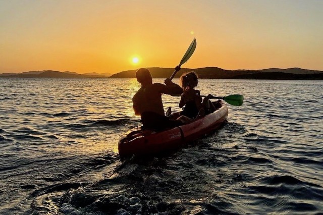 Visit Sardinia Sunset Kayak Tour with Snorkeling and Aperitif in Circeo, Italia