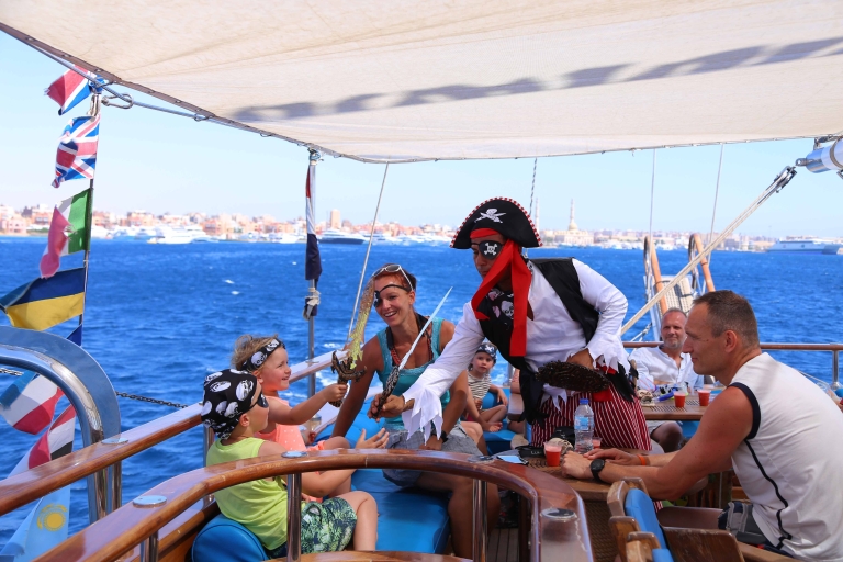 Pirates sailing Boat with white island and snorkelling