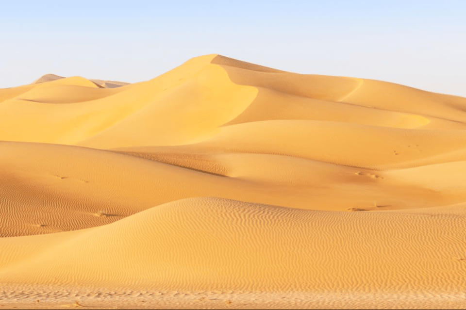 From Muscat: North Dunes and Wadi Hot Spring Tour with Lunch | GetYourGuide