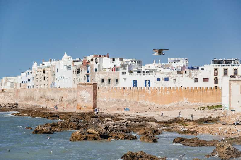 Discover The Top 10 Places To Visit In Morocco - Strolling along Essaouira's historic ramparts and beaches